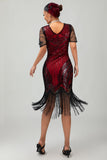 Vestido flapper ajustado de lentejuelas doradas negras de los años 20 con borlas