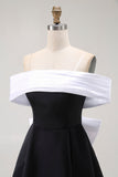 Vestido de cóctel corto con hombros descubiertos en negro con lazo