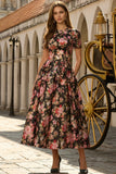 Vestido negro rosa de manga corta de satén midi con flor rosa y bolsillos