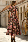 Vestido negro rosa de manga corta de satén midi con flor rosa y bolsillos