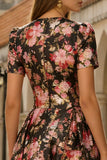 Vestido negro rosa de manga corta de satén midi con flor rosa y bolsillos