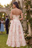 Vestido midi sin tirantes con moño rosa de flores blancas y estampado en línea A