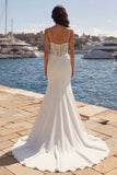 Vestido de novia con liquado de sirena en marfil y cola de corte