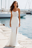 Vestido largo de novia con tirantes finos de marfil y abertura
