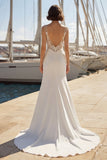 Vestido de novia con tirantes finos aplicados en marfil sirena y abertura