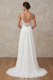 Vestido de novia de tirantes finos de marfil con cordones barridos