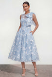 Vestido midi rosa floral con arco y cuello redondo, bolsillos