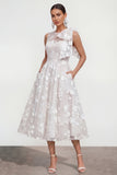 Vestido midi rosa floral con arco y cuello redondo, bolsillos