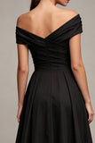 Vestido formal negro de franzas largas y línea A fuera del hombro