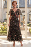 Vestido largo de madre de la novia bordado con tul negro en pico