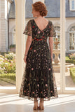 Vestido largo de madre de la novia bordado con tul negro en pico
