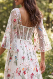 Vestido de novia largo corsé floral translúcido marfil línea A con abertura