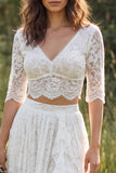 Vestido de novia largo de encaje marfil con escote en V y manga media con abertura