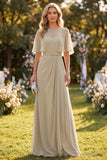 Vestido largo de escote redondo de gasa taupe con cinturón