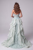 Vestido largo de concurso con corsé de sirena verde menta transparente, lentejuelas, con cola de volantes