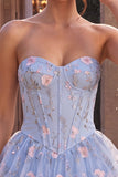 Corsé sin tirantes azul Línea A floral con volantes y cintura vasca vestido de bienvenida