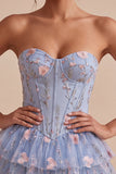 Corsé sin tirantes azul Línea A floral con volantes y cintura vasca vestido de bienvenida