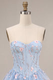 Corsé sin tirantes azul Línea A floral con volantes y cintura vasca vestido de bienvenida