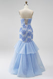 Vestido de graduación de organza sin tirantes de sirena azul sin tirantes florales con volantes