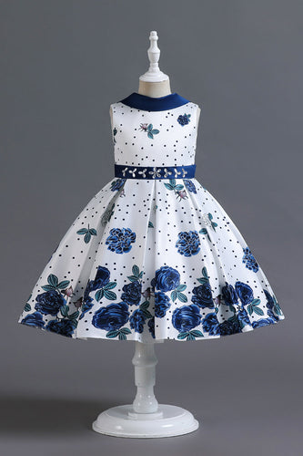 Una línea de cuello joya azul estampado vestido de niña