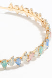 Diadema de pedrería dorada