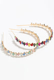 Diadema de pedrería dorada