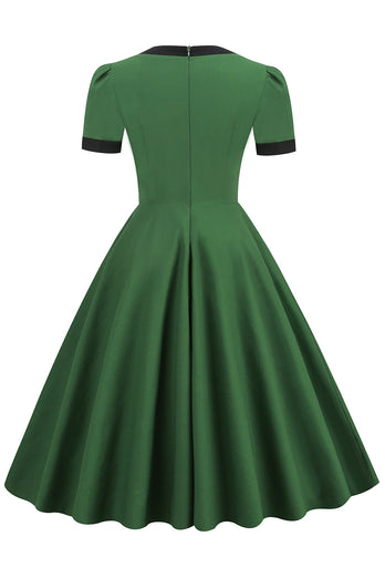 Vestido de swing verde oscuro de la década de 1950 con lazo