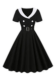 Vestido swing negro de la década de 1950 con cinturón