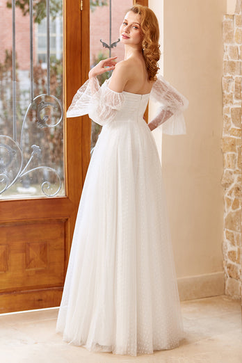 Vestido de novia de tul blanco sin hombros