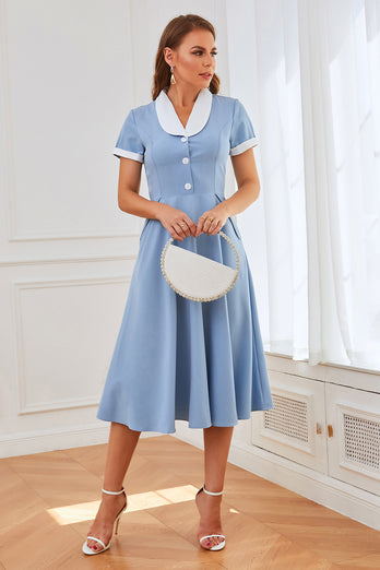 Vestido swing azul de la década de 1950 con bolsillos