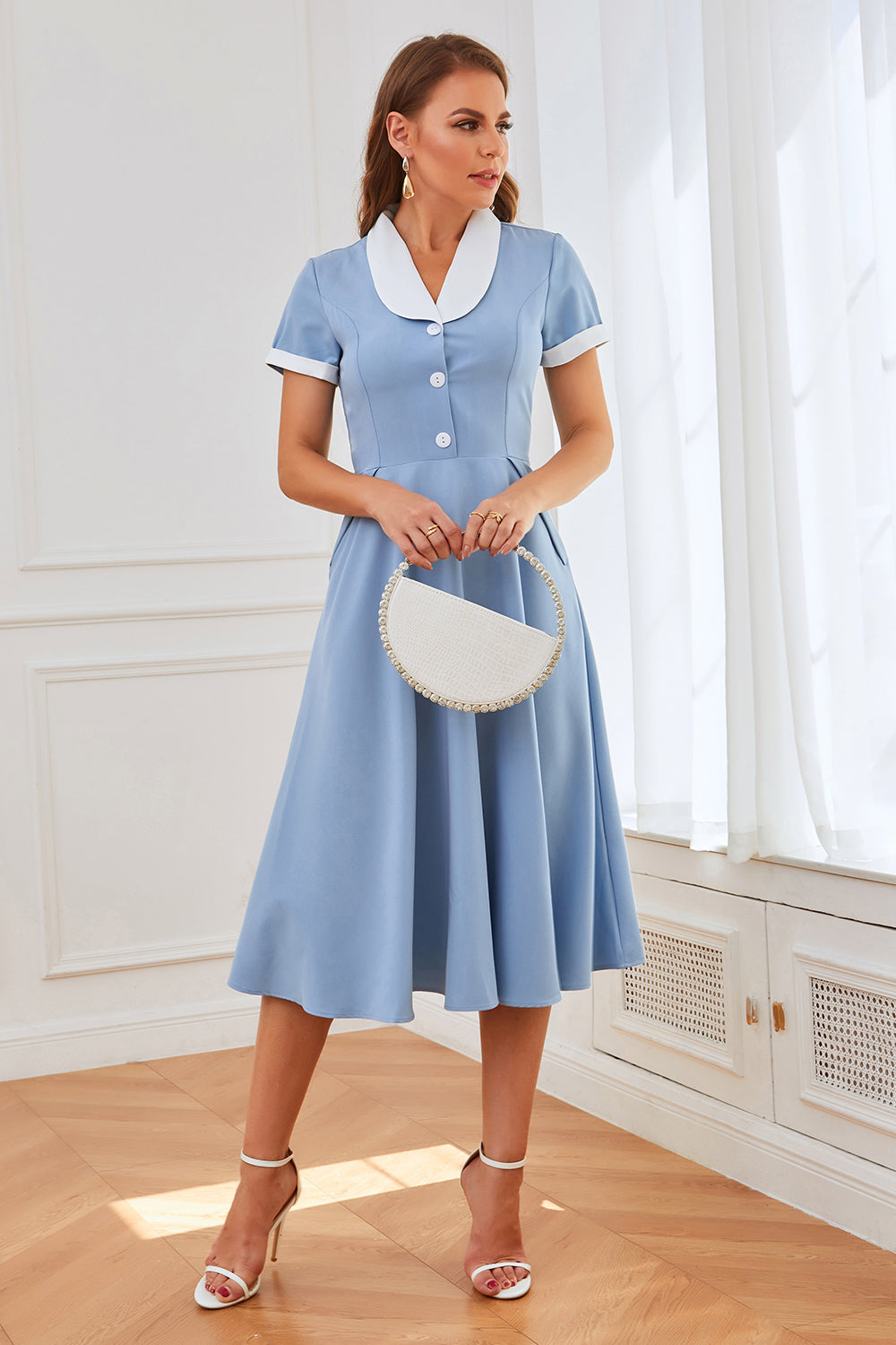 Vestido swing azul de la década de 1950 con bolsillos