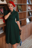 Vestido verde oscuro vintage de la década de 1950