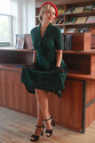 Vestido verde oscuro vintage de la década de 1950
